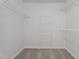 Walk-in closet with built-in shelving for ample storage at 185 Keller Dr, Clayton, NC 27520