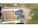 Aerial view of house with gray roof and long driveway on large lot at 188 Banner Elk Rd, Benson, NC 27504