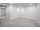 Unfinished basement with neutral carpet, recessed lighting, and white walls at 188 Banner Elk Rd, Benson, NC 27504