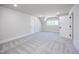 Bedroom with neutral carpet, a vaulted ceiling, and a window with bright natural light at 188 Banner Elk Rd, Benson, NC 27504