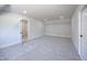 Expansive bedroom features neutral carpet, high ceilings, and an open doorway at 188 Banner Elk Rd, Benson, NC 27504