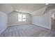 Light-filled bedroom with dormer window and neutral carpet, offering a serene and comfortable retreat at 188 Banner Elk Rd, Benson, NC 27504