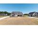 New construction home with stone and siding exterior with a covered porch at 188 Banner Elk Rd, Benson, NC 27504