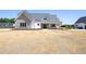 New construction home with stone accents, and landscaping at 188 Banner Elk Rd, Benson, NC 27504