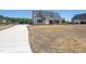 New construction home with long drive, and fresh landscaping at 188 Banner Elk Rd, Benson, NC 27504