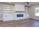 Living room fireplace featuring built-in shelving and cabinets at 188 Banner Elk Rd, Benson, NC 27504
