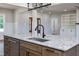 Kitchen island featuring granite countertops, stainless steel dishwasher, and wood cabinets at 188 Banner Elk Rd, Benson, NC 27504