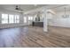 Bright, open living area with wood floors, island kitchen, and abundant natural light at 188 Banner Elk Rd, Benson, NC 27504