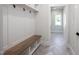 Mudroom featuring a built in bench with hooks and storage at 188 Banner Elk Rd, Benson, NC 27504