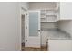 Walk-in pantry with a frosted door and white shelving at 188 Banner Elk Rd, Benson, NC 27504