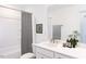 Clean and well-maintained bathroom with a shower-tub combo, white vanity, and tasteful decor at 198 Blue Butterfly Dr, Angier, NC 27501