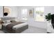 Well-lit bedroom with modern decor, a comfortable bed, and large windows providing natural light at 198 Blue Butterfly Dr, Angier, NC 27501
