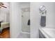 Well-lit bathroom featuring shower with glass door, vanity with grey countertop and storage at 200 W Woodcroft Pkwy # 57B, Durham, NC 27713