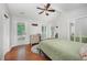 Bright bedroom with a ceiling fan and direct access to a porch, ideal for relaxation at 200 W Woodcroft Pkwy # 57B, Durham, NC 27713