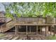 Backyard deck and stairs from ground with under deck foundation and space for storage or garden at 200 W Woodcroft Pkwy # 57B, Durham, NC 27713
