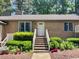 Charming brick home featuring a cozy entrance, well-maintained landscaping, and ample natural light at 200 W Woodcroft Pkwy # 57B, Durham, NC 27713