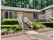 Delightful brick home with an inviting entrance, neat landscaping, and colorful floral accents at 200 W Woodcroft Pkwy # 57B, Durham, NC 27713