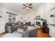 Inviting living room with vaulted ceilings, fireplace, modern furniture, and ample natural light at 200 W Woodcroft Pkwy # 57B, Durham, NC 27713