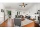 Inviting living room with vaulted ceilings, fireplace, modern furniture, and ample natural light at 200 W Woodcroft Pkwy # 57B, Durham, NC 27713