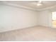 Large bedroom boasting tray ceiling and neutral carpet with an ensuite bathroom at 203 Chilcott Ln, Apex, NC 27502
