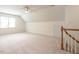 Bright, airy bonus room with neutral carpet, modern fan, and ample natural light at 203 Chilcott Ln, Apex, NC 27502