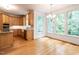 Charming kitchen with wood cabinetry and large windows offering ample natural light at 203 Chilcott Ln, Apex, NC 27502