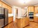 Modern kitchen with island and stainless-steel refrigerator at 203 Chilcott Ln, Apex, NC 27502