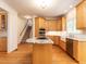 Well-designed kitchen featuring an island with a cooktop and modern appliances at 203 Chilcott Ln, Apex, NC 27502