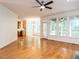 Bright open-concept living area with a hardwood floor and large windows at 203 Chilcott Ln, Apex, NC 27502