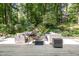Outdoor seating area featuring wicker furniture, perfect for enjoying nature at 203 Old Forest Creek Dr, Chapel Hill, NC 27514
