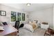 Bedroom with a well-lit desk, comfortable bed, and window view of lush trees at 203 Old Forest Creek Dr, Chapel Hill, NC 27514