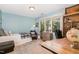 Bright bedroom with desk area, large window, and a view of the beautiful surrounding trees at 203 Old Forest Creek Dr, Chapel Hill, NC 27514