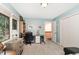 Comfortable bedroom with natural light, built-in shelves, and ample desk space at 203 Old Forest Creek Dr, Chapel Hill, NC 27514