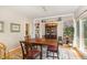 Elegant dining room featuring built-in shelving and a large window at 203 Old Forest Creek Dr, Chapel Hill, NC 27514