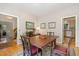 Charming dining area with hardwood floors, open layout, and natural light at 203 Old Forest Creek Dr, Chapel Hill, NC 27514