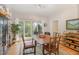 Bright dining room with hardwood floors and large picture window at 203 Old Forest Creek Dr, Chapel Hill, NC 27514