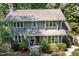 Charming two-story home featuring a well-manicured lawn and a welcoming front entrance at 203 Old Forest Creek Dr, Chapel Hill, NC 27514