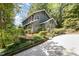 Exterior of the home with well-manicured landscaping and a charming front entrance at 203 Old Forest Creek Dr, Chapel Hill, NC 27514