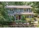 Beautiful two-story home showcasing an attractive front entrance and mature landscaping at 203 Old Forest Creek Dr, Chapel Hill, NC 27514