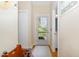 Light-filled hallway featuring hardwood floors and neutral paint at 203 Old Forest Creek Dr, Chapel Hill, NC 27514
