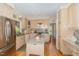 Bright kitchen with stainless steel appliances, granite countertops, and a central island offers functionality at 203 Old Forest Creek Dr, Chapel Hill, NC 27514