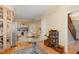 Bright kitchen featuring light cabinetry and stainless steel appliances, all with hardwood flooring at 203 Old Forest Creek Dr, Chapel Hill, NC 27514