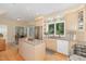 Bright, modern kitchen featuring granite countertops and stainless steel appliances at 203 Old Forest Creek Dr, Chapel Hill, NC 27514