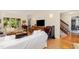 Comfortable living room showcasing hardwood floors, fireplace, and spacious layout at 203 Old Forest Creek Dr, Chapel Hill, NC 27514