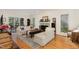 Inviting living room featuring hardwood floors, fireplace, and abundant natural light at 203 Old Forest Creek Dr, Chapel Hill, NC 27514