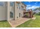Backyard view highlighting a patio, a tiered deck, and a well-maintained lawn at 208 Bridle Boast Rd, Cary, NC 27519