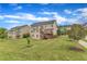 Expansive backyard featuring a deck, lush lawn, and mature trees, perfect for outdoor enjoyment at 208 Bridle Boast Rd, Cary, NC 27519