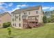 Spacious backyard includes a large deck and well-manicured lawn, creating an inviting outdoor space at 208 Bridle Boast Rd, Cary, NC 27519