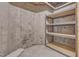 Unfinished basement area includes shelving for practical storage solutions at 208 Bridle Boast Rd, Cary, NC 27519