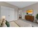 Inviting bedroom with a dresser, double-door wardrobe, an airy feel, and trendy decor at 208 Bridle Boast Rd, Cary, NC 27519